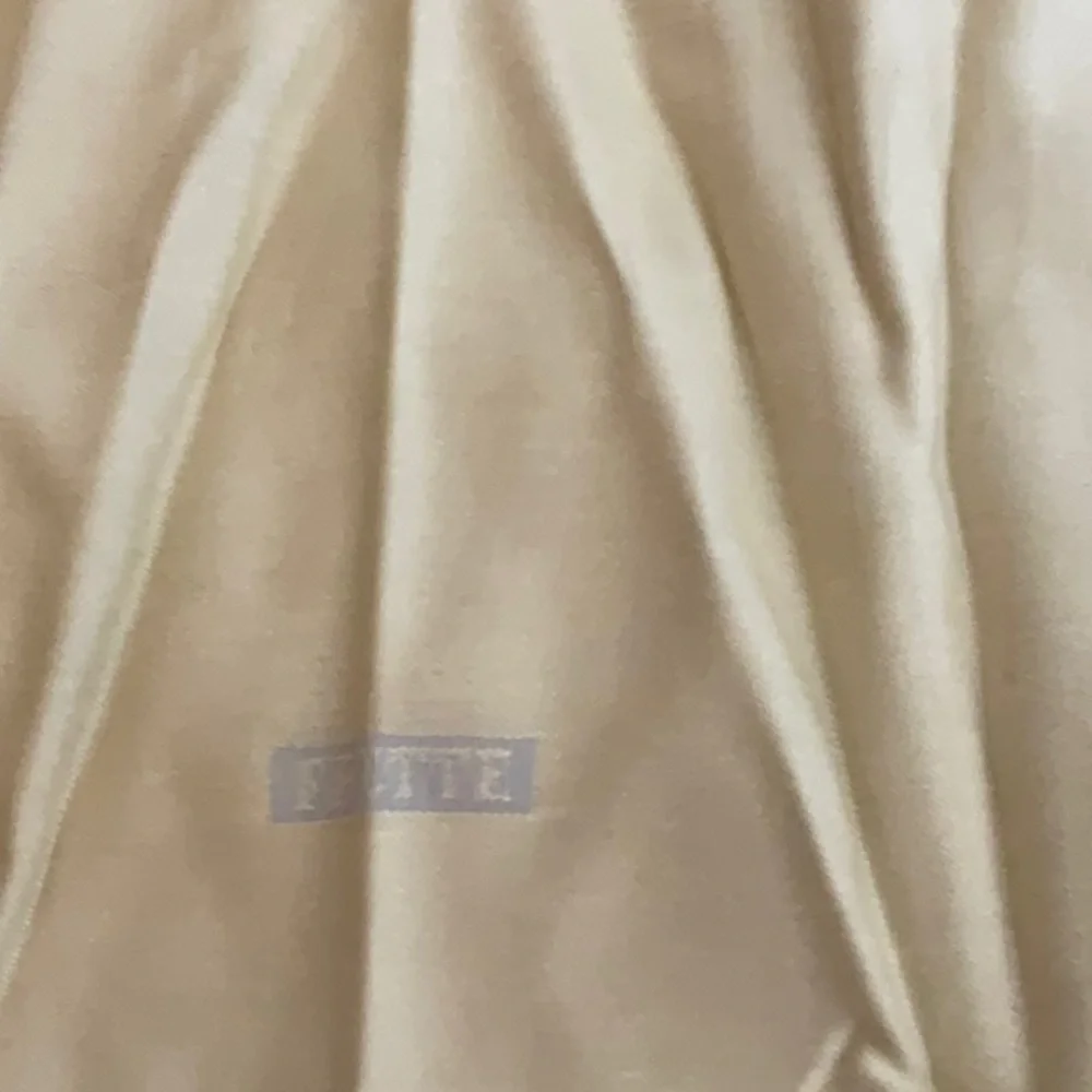 NEW FRETTE SET OF FOUR NAPKINS COLOR IS LIKE A FLAX WITH GREY/SILVER OTHER SIDE